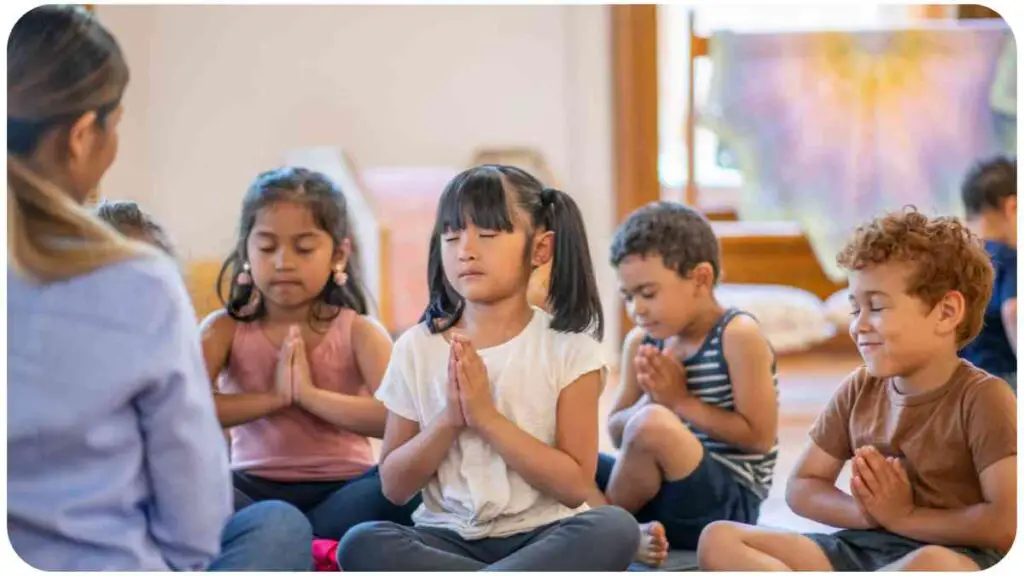 a group of people sitting on the floor in a yoga class