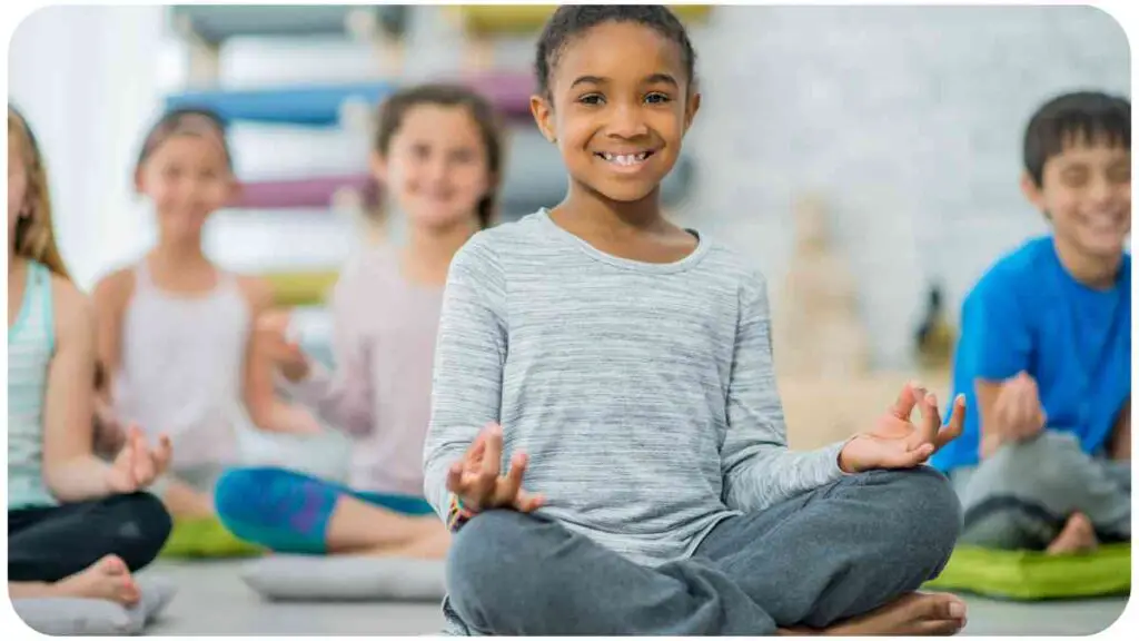 a group of individuals are sitting in a yoga class.