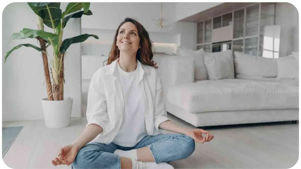 a person meditating in their living room