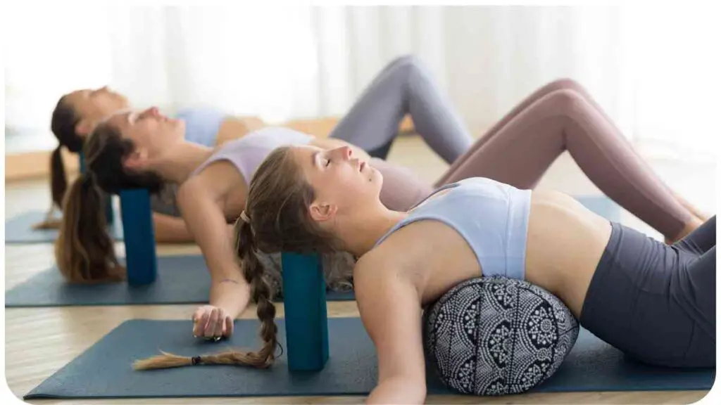 a group of people doing yoga on a mat