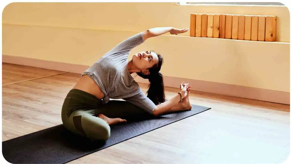 a person is doing a yoga pose on a yoga mat