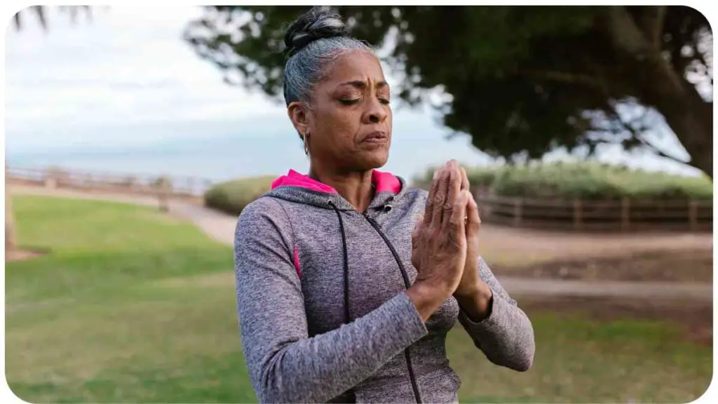 an individual doing yoga in the park