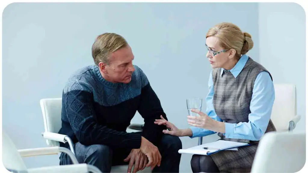 a person and person sitting in chairs talking to each other