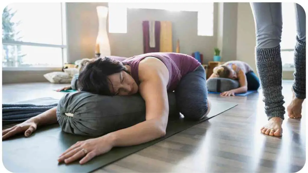 a person laying on their back on a yoga mat